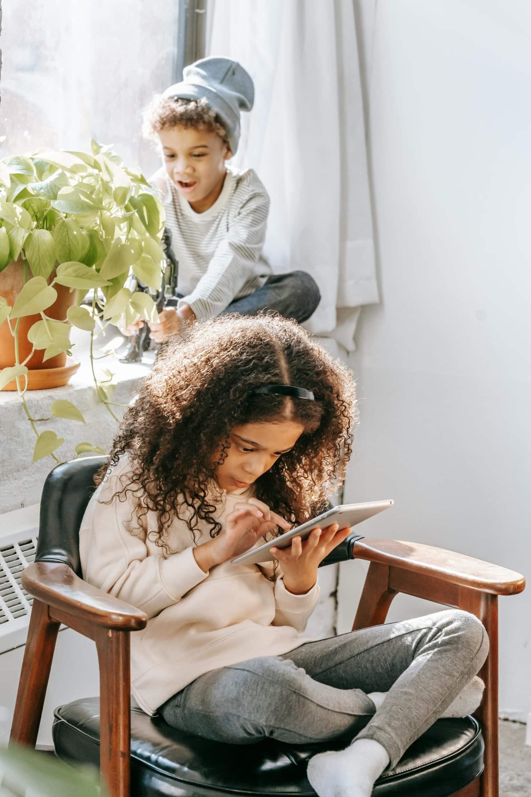 Child playing on ipad.