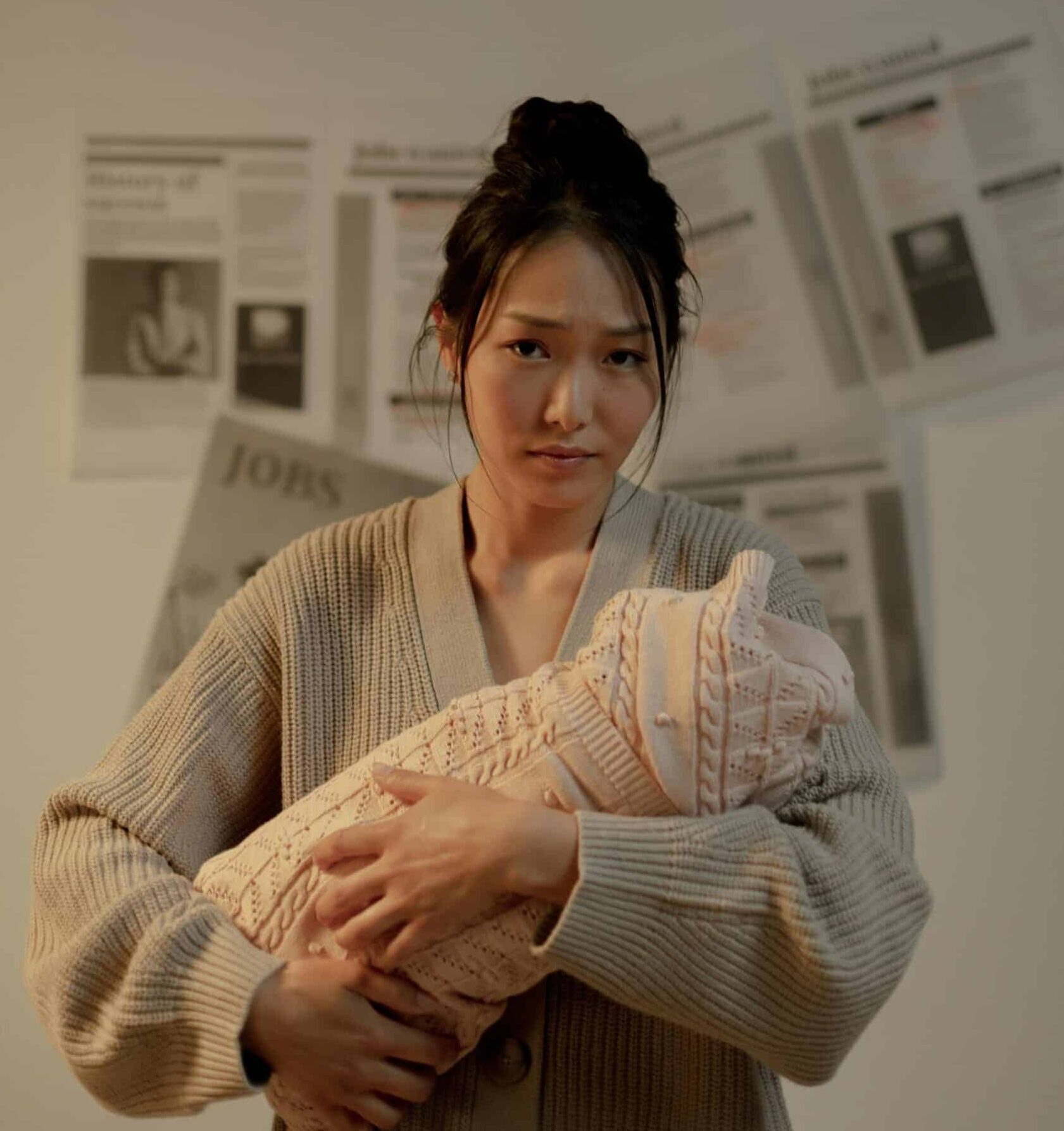 A new parent lacking confidence and looking upset.