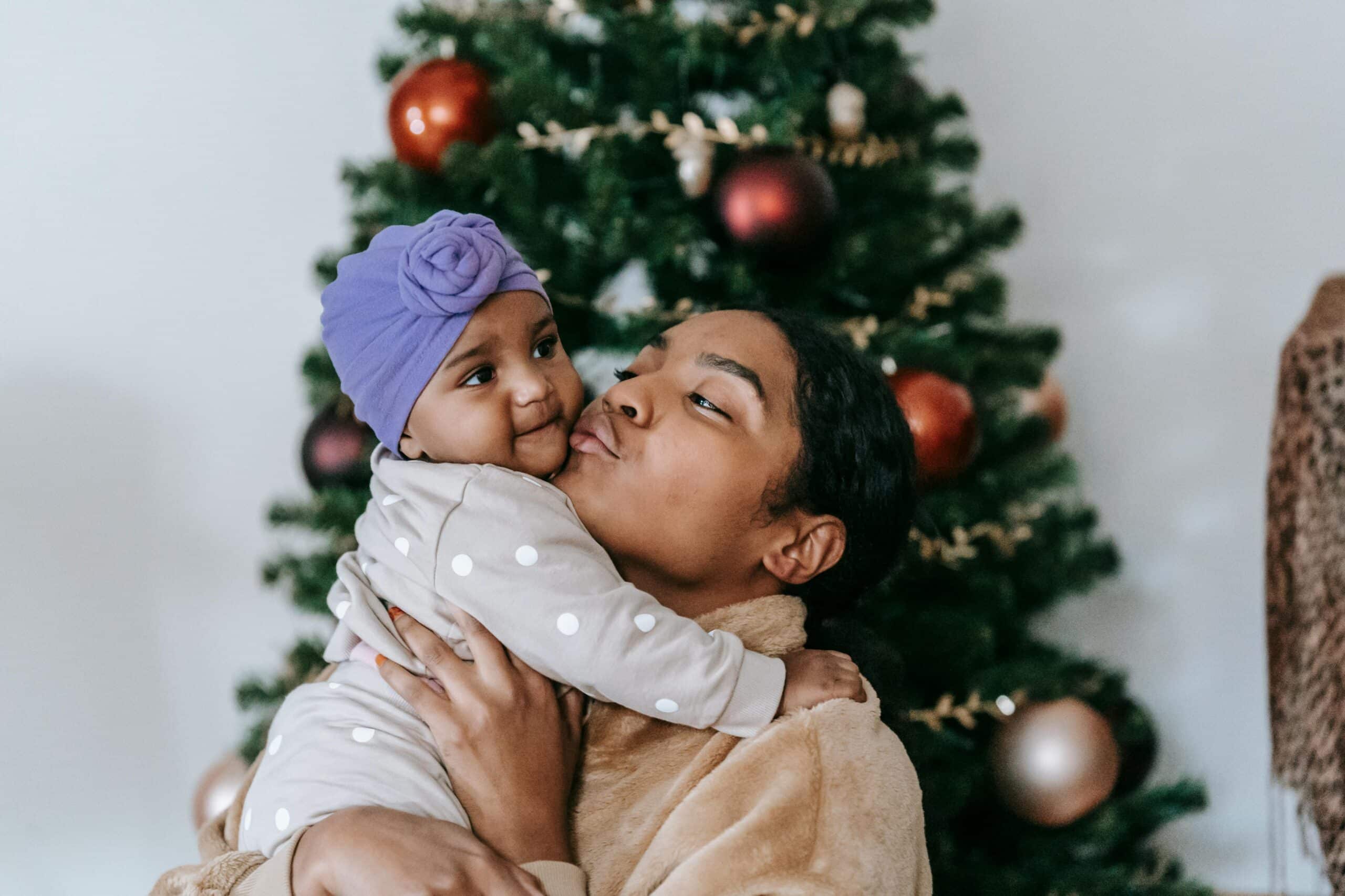 A new parent becoming more confident, looking happy while holding baby.
